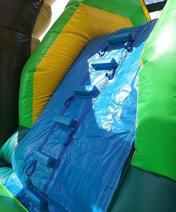 Steps to the big slide on our Tropical bouncy castle